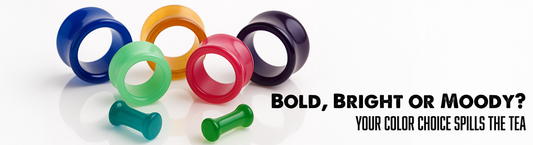 various solid colored glass tunnels on white marble
